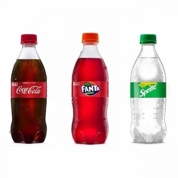 Three carbonated beverages Coca Cola, Fanta and Sprite in plastic bottles red and green labels.
