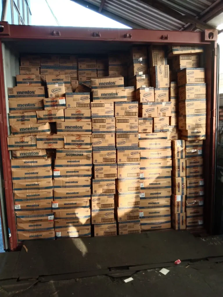 Shipping container loaded with Mentos and Oreo products for export by Inti Mandiri Jayatama