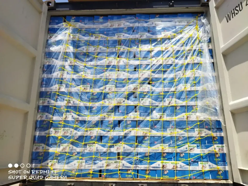 Container shipment loaded with product packages secured with yellow strapping by Inti Mandiri Jayatama